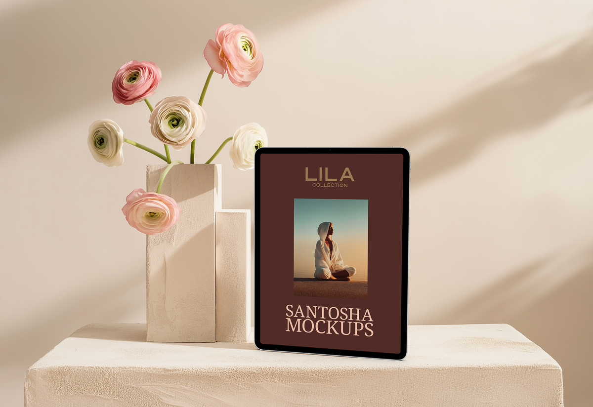 Studio Santosha LILA Collection iPad mockup displayed on a stone block beside pastel ranunculus flowers, styled with soft light and minimal shadows.