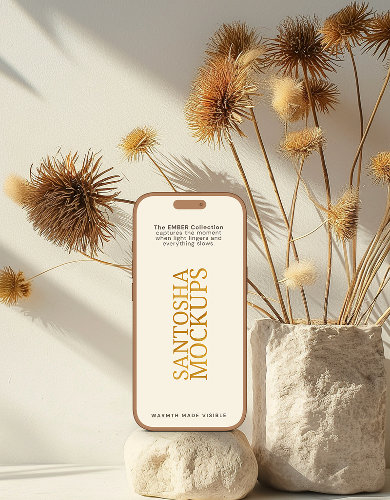 iPhone mockup from the EMBER Collection by Studio Santosha, styled with dried florals, stone textures, and soft golden light — evoking warmth made visible.