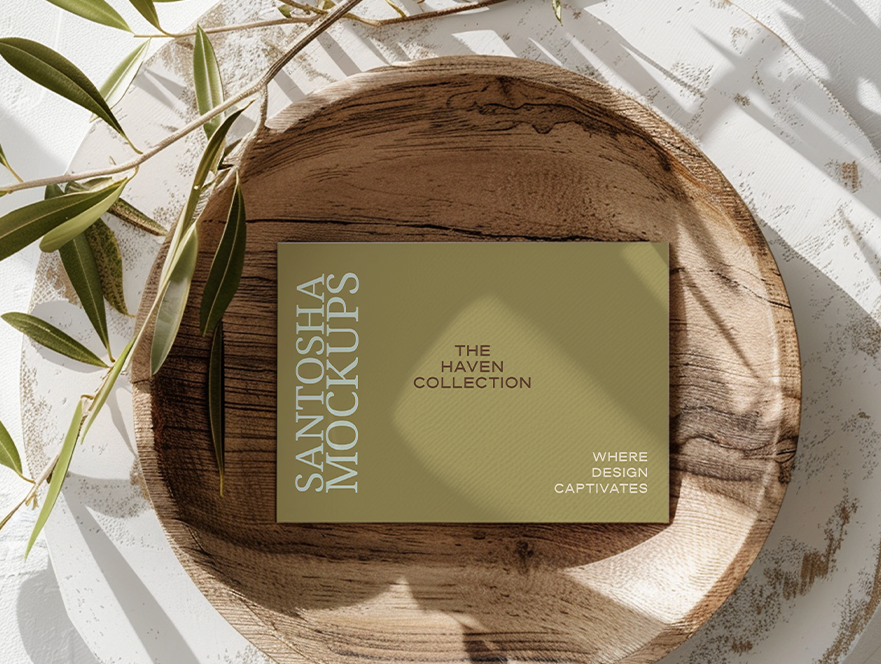 Studio Santosha HAVEN Collection card mockup on a wooden bowl with olive branch and soft natural light.