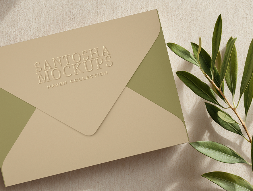 Studio Santosha HAVEN Collection envelope mockup in warm beige and olive tones, styled with fresh olive branch on a softly textured surface.