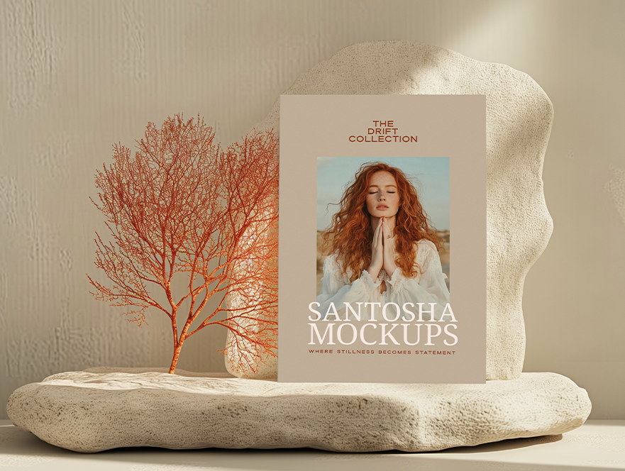 A4 paper mockup from the DRIFT Collection by Studio Santosha, displayed on a textured stone pedestal with coral decoration and soft natural light.