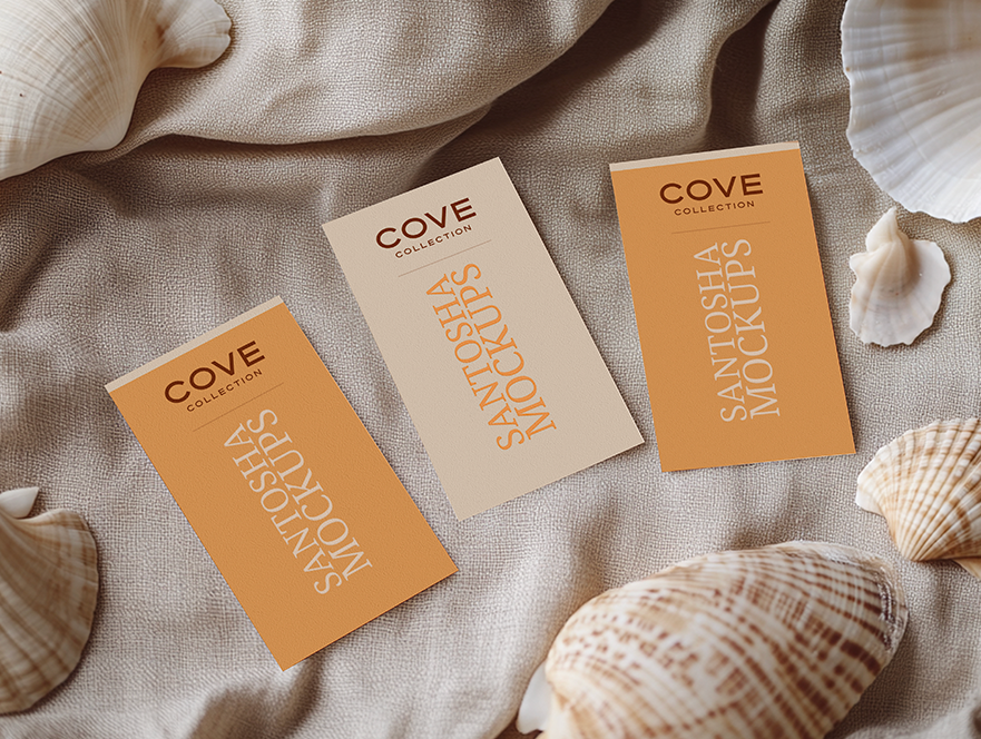 Three vertical mockup cards from Studio Santosha's Cove Collection, displayed on textured fabric with scattered seashells