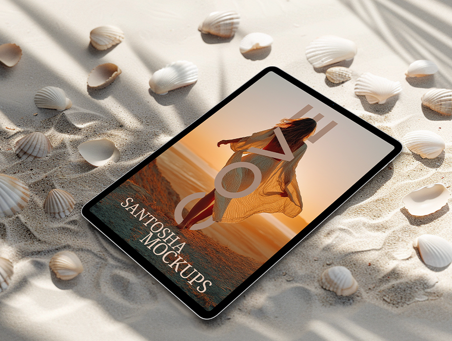 Tablet mockup from Studio Santosha's Cove Collection, featuring a beach scene with a woman at sunset, displayed on sand with scattered seashells