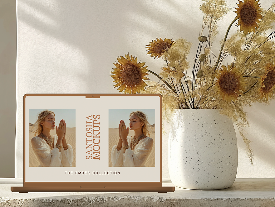 iPad and card upright together, styled with daisy bouquet and golden hue, from the EMBER Collection.