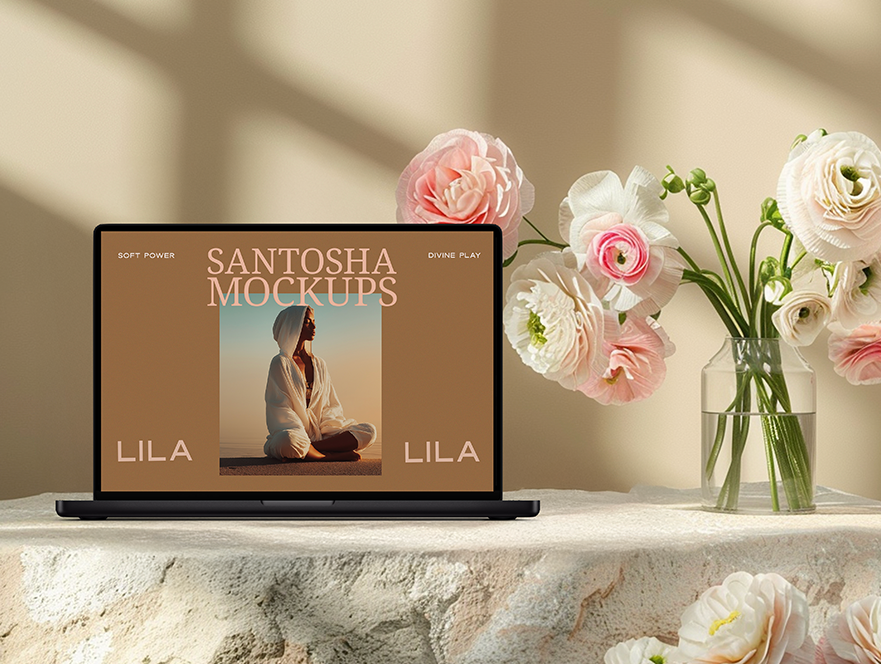Studio Santosha LILA Collection MacBook Pro mockup displayed on a stone surface, with soft blooms in glass vases and scattered flowers in the background.