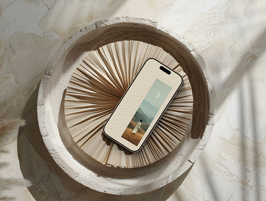 iPhone mockup from the SOHL Collection by Studio Santosha — displayed on a textured stone surface with a circular tray and dried palm fronds in soft natural light.