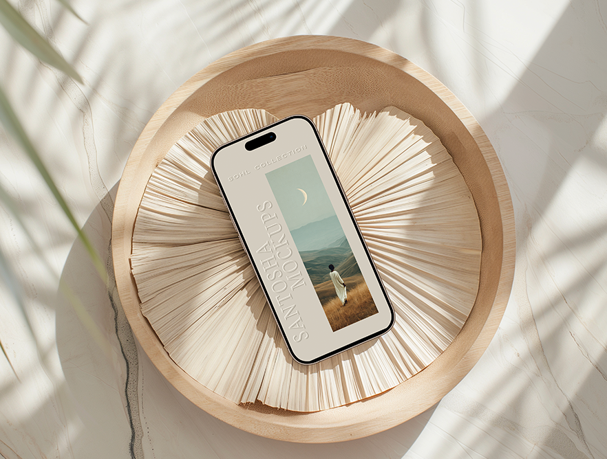 iPhone mockup from the SOHL Collection by Studio Santosha — styled on a wooden plate with layered dried palm textures and soft natural shadows